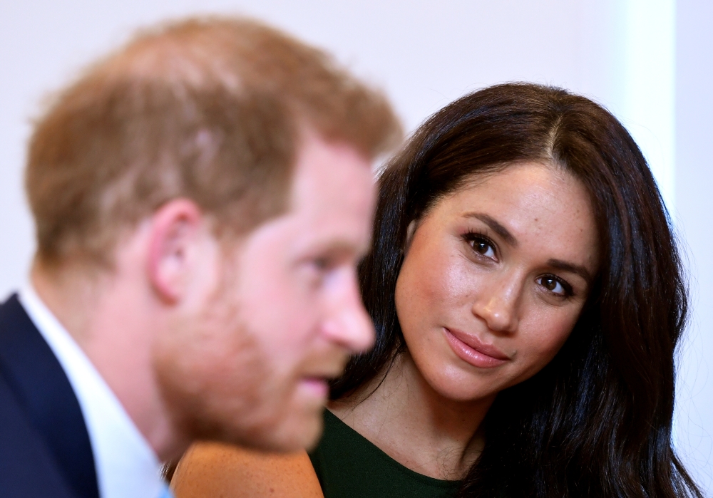 Meghan, Duchess of Sussex, looks at Britain's Prince Harry during the WellChild Awards pre-ceremony reception in London, Britain, in this Oct. 15, 2019 file photo. — Reuters