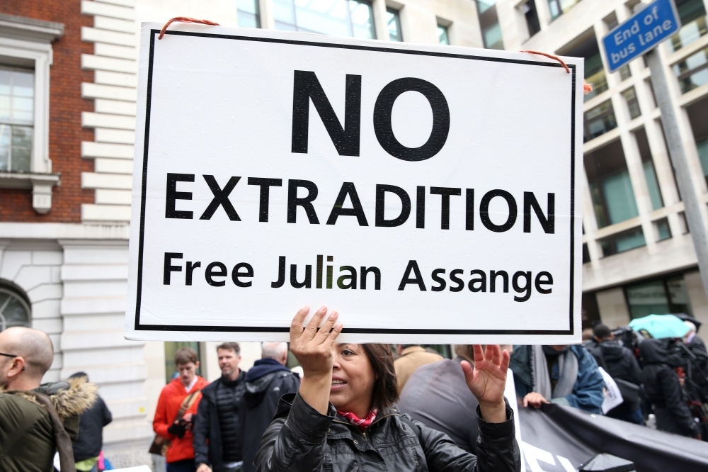 Demonstrators protest outside Westminster Magistrates Court in London on Monday, where WikiLeaks founder Julian Assange has been attending a case management hearing as he fights extradition to the United States. — AFP