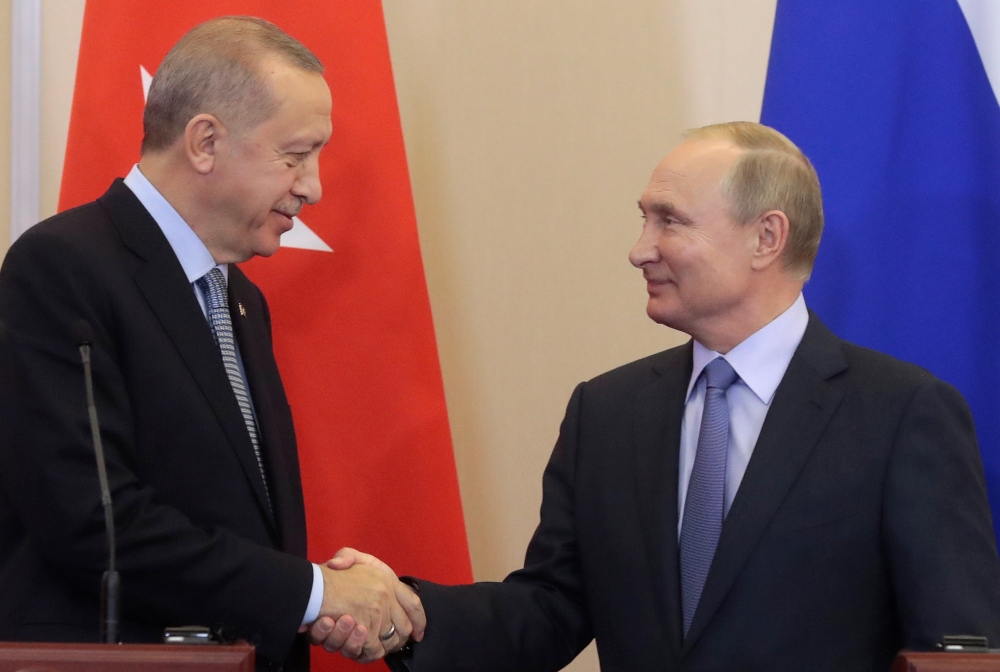 Russian President Vladimir Putin, right, shakes hands with Turkish President Recep Tayyip Erdogan, left,  during their joint news conference following Russian-Turkish talks in the Black sea resort of Sochi, Russia, on Tuesday. — Reuters