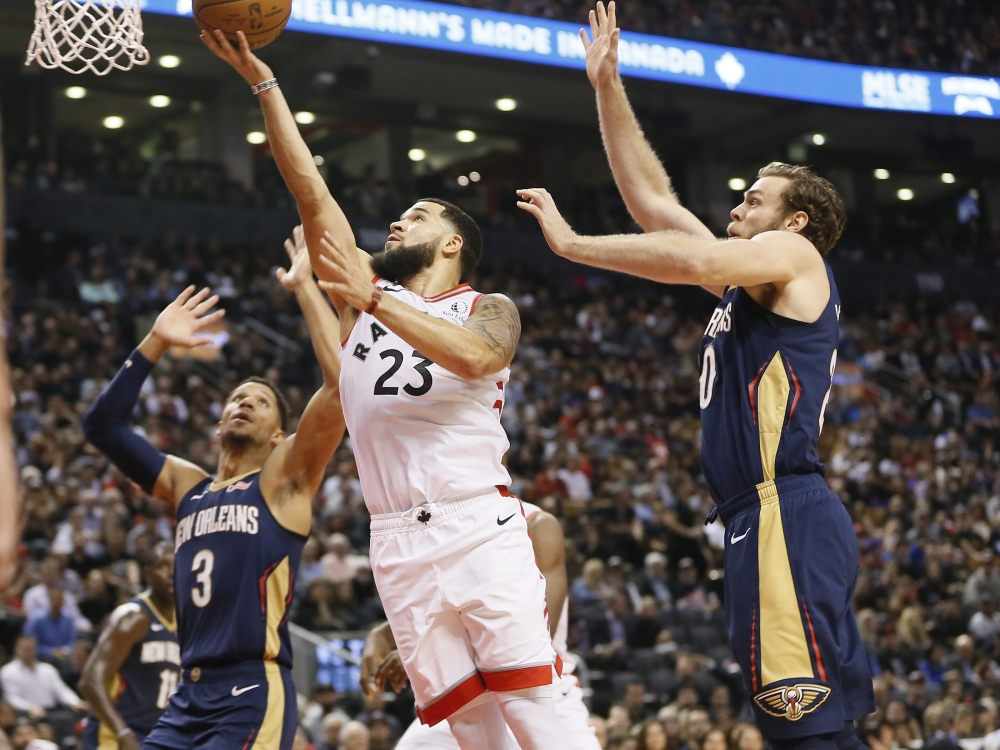 Toronto Raptors guard Fred VanVleet (23) goes up to make a basket against New Orleans Pelicans guard Josh Hart (3) and forward Nicolo Melli (20) at Scotiabank Arena, Toronto, Ontario, on Tuesday. Toronto defeated New Orleans in overtime. — Reuters