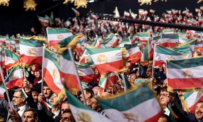 Members of Mujahedin-e Khalq waving Iranian flags at a camp in Manza, Albania, in this file photo. — AFP