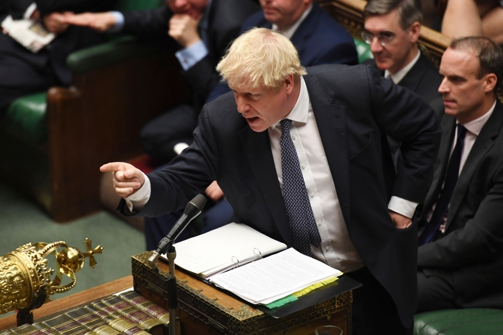 UK Parliament Britain's Prime Minister Boris Johnson gestures during the Prime Minister's Questions (PMQs) session in the House of Commons in London on Wednesday. — AFP