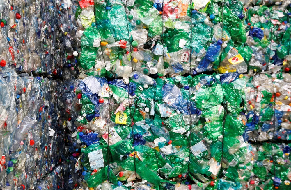 FILE PHOTO: Bundles of pressed PET (polyethylene terephthalate) bottles made out of plastic are seen at the Transcycle Transport & Recycling AG company in Neuenhof, Switzerland, in this Nov. 22, 2018 file photo. — Reuters