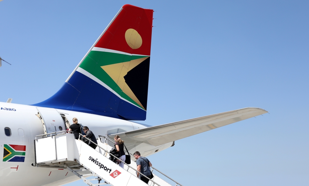 Passengers board a South African Airways plane at the Port Elizabeth International Airport in the Eastern Cape province, South Africa, in thos Sept. 30, 2018 file photo. — Reuters