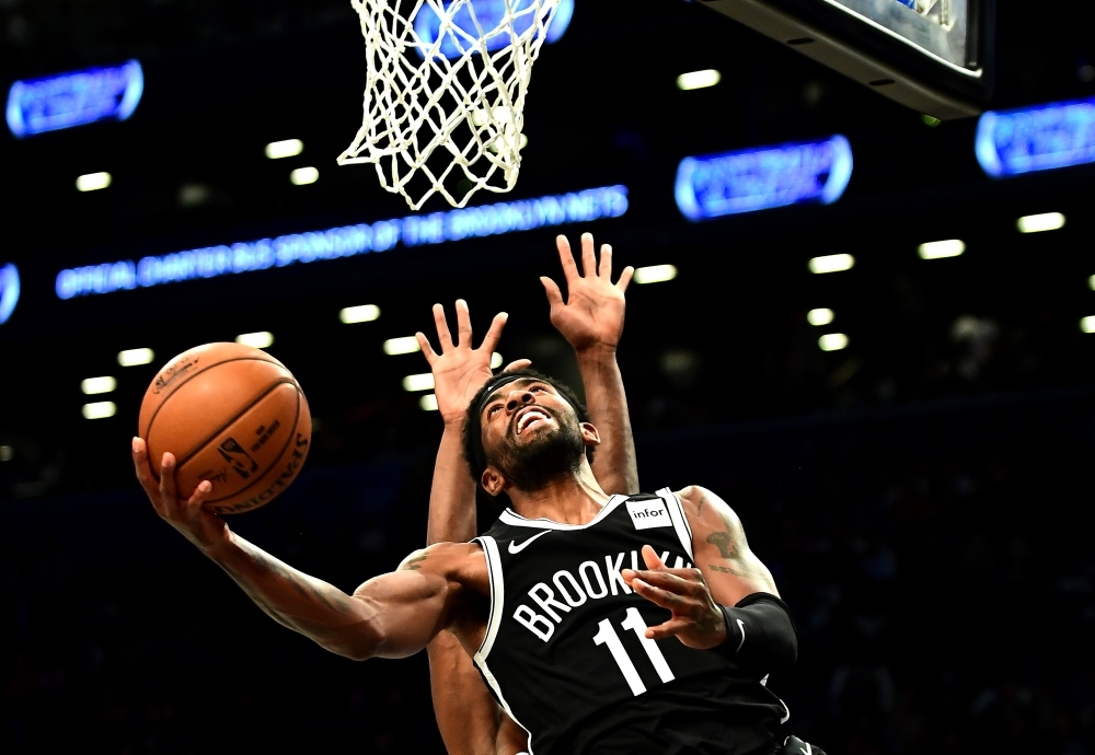 Kyrie Irving No. 11 of the Brooklyn Nets goes in for a layup during the first half of their game against the Minnesota Timberwolves at Barclays Center on Wednesday in the Brooklyn borough of New York City. — AFP