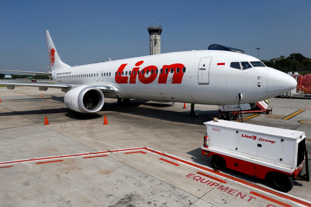 Indonesia's National Transportation Safety Committee (KNKT) investigator Nurcahyo Utomo (L) briefs journalists during a press conference on the final report of the Lion Air flight 610 crash, in Jakarta on Friday. Design flaws in the Boeing 737 Max's flight-control system was a key factor in the crash of a Lion Air jet, which killed 189 people, Indonesian investigators said in their final report on the disaster.  — AFP
