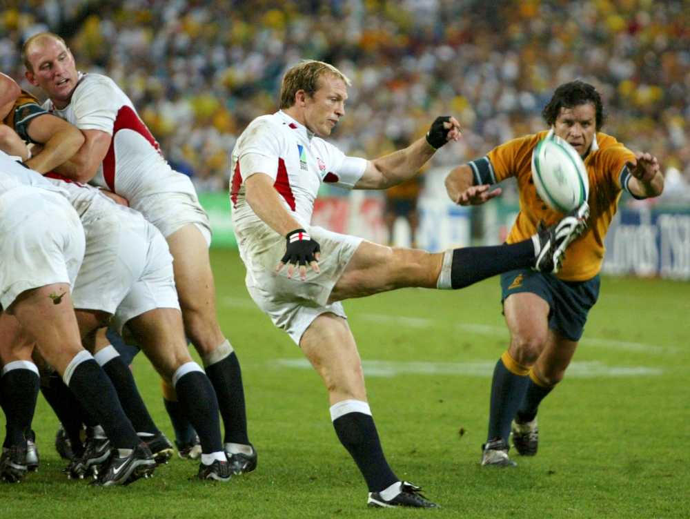 England’s Matt Dawson gets his kick away under the challenge of  Australia's Brendan Cannon during the rugby World Cup final at the  Olympic Stadium in Sydney in this file photo. — Reuters