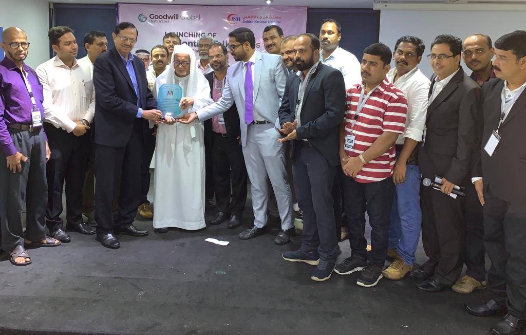 Dr. M.S. Karimuddin and Ali Muhammed Ali present a memento to Dr. Mohammed Ali Al-Bar.