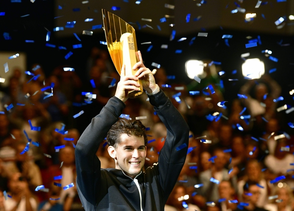 Austria's Dominic Thiem poses with the trophy after winning the final match against Argentina's Diego Schwartzman (not in picture) at the ATP Tour tennis tournament in Vienna, Austria, on Sunday. Thiem won the match 3-6, 6-4, 6-3. — AFP