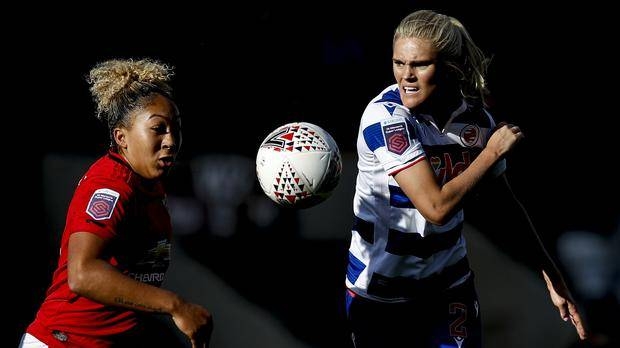 Manchester United’s Lauren James (L) battles for the ball with Reading’s Kristine Liene, during their Women’s Super League match at Leigh Sports Village in England on Sunday.  — Courtesy photo