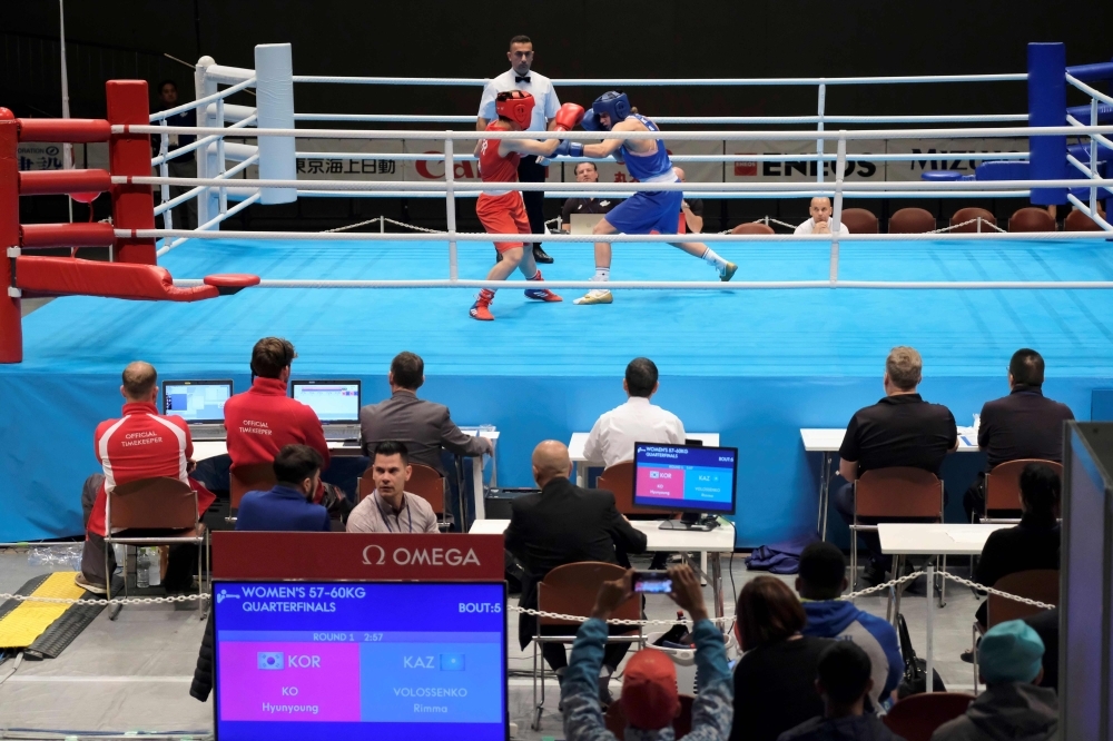 Judges and boxing match operators watch a test event at Kokugikan Arena, a venue of the Tokyo 2020 Olympic Games, in Tokyo, on Wednesday. — AFP