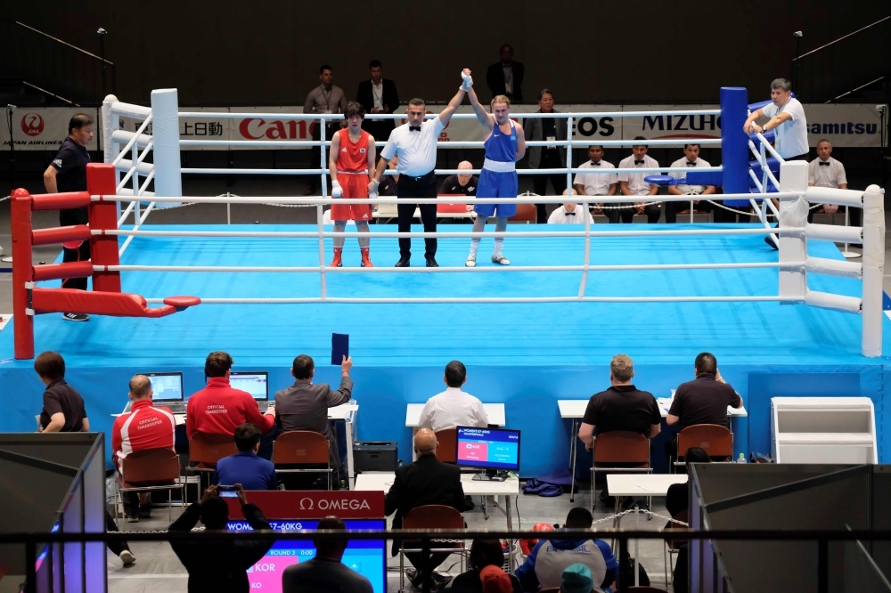 Judges and boxing match operators watch a test event at Kokugikan Arena, a venue of the Tokyo 2020 Olympic Games, in Tokyo, on Wednesday. — AFP