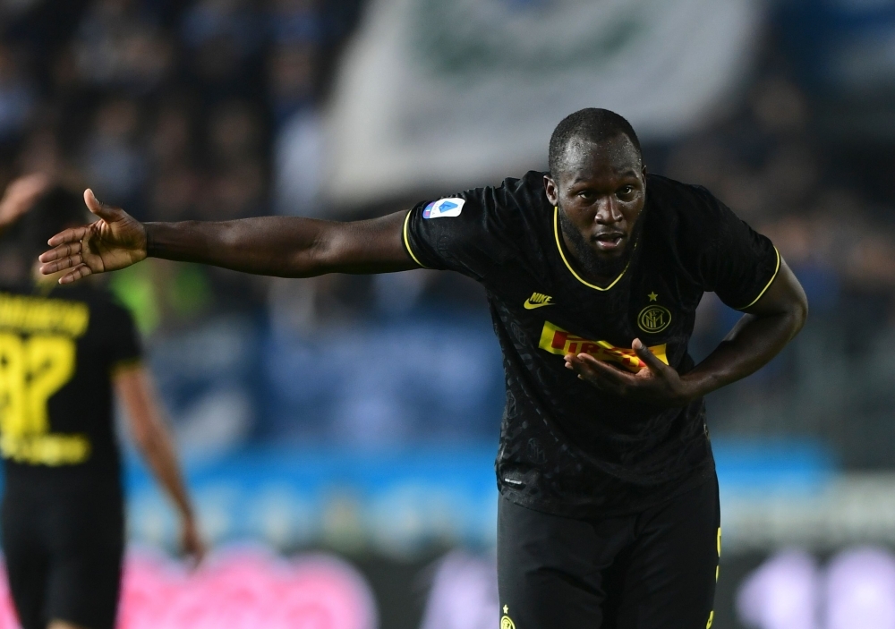 Inter Milan's Belgian forward Romelu Lukaku celebrates scoring his team's second goal during the Italian Serie A football match Brescia vs Inter Milan at the Mario-Rigamonti stadium in Brescia, on Tuesday. — AFP