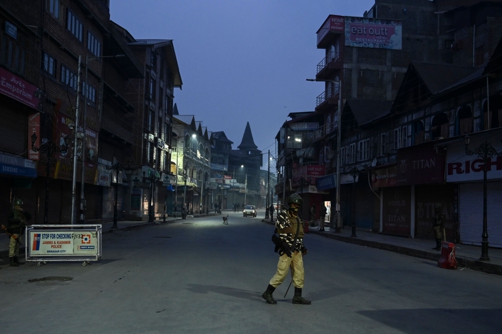 Indian paramilitary troopers stand guard at a road checkpoint during a lockdown in Srinagar on Wednesday. — AFP