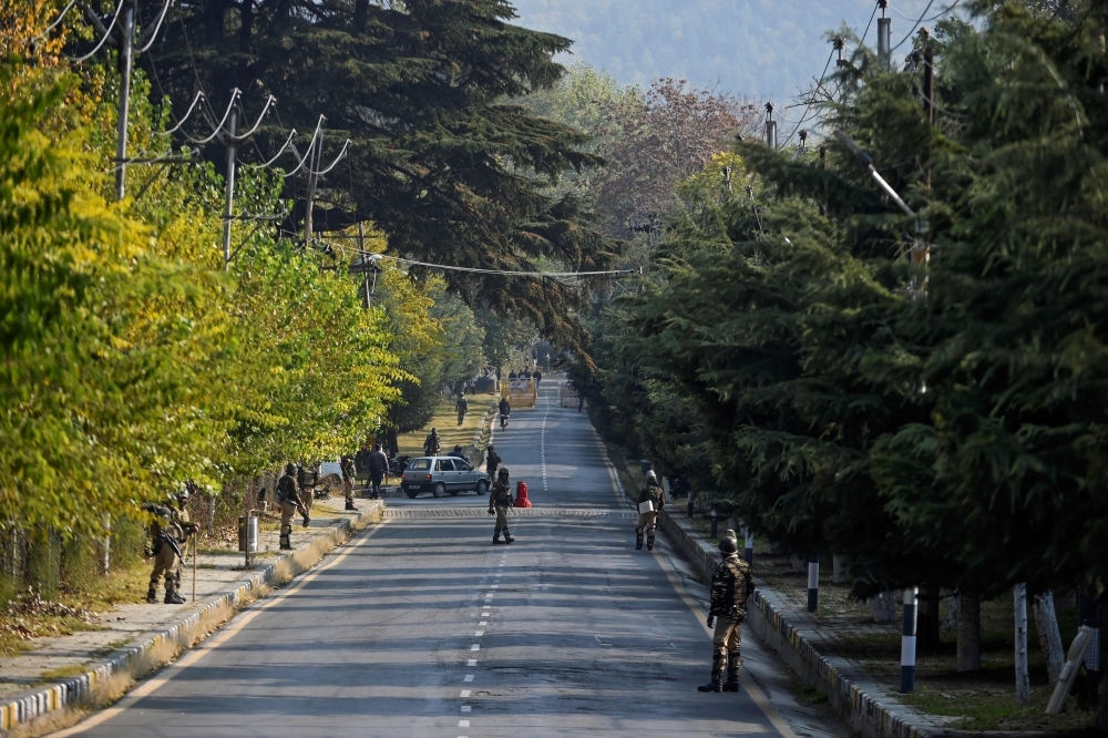 Soldiers stand guard near Raj Bhavan, the official governor's residence, ahead of the swearing-in ceremony of first lieutenant governor of Jammu and Kashmir union territory, in Srinagar on Thursday. — AFP