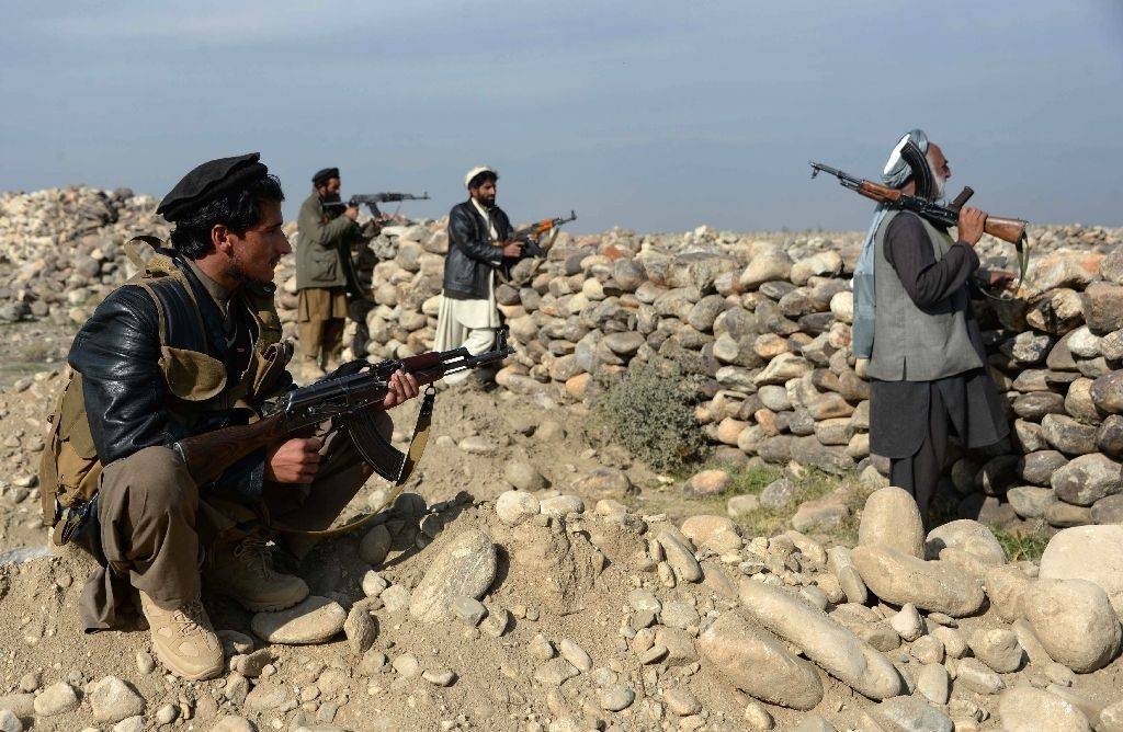 Afghan militia forces keep watch during ongoing clashes with Daesh (the so-called IS) fighters in Achin district of Nangarhar province in this Dec. 27, 2015 file photo. — AFP