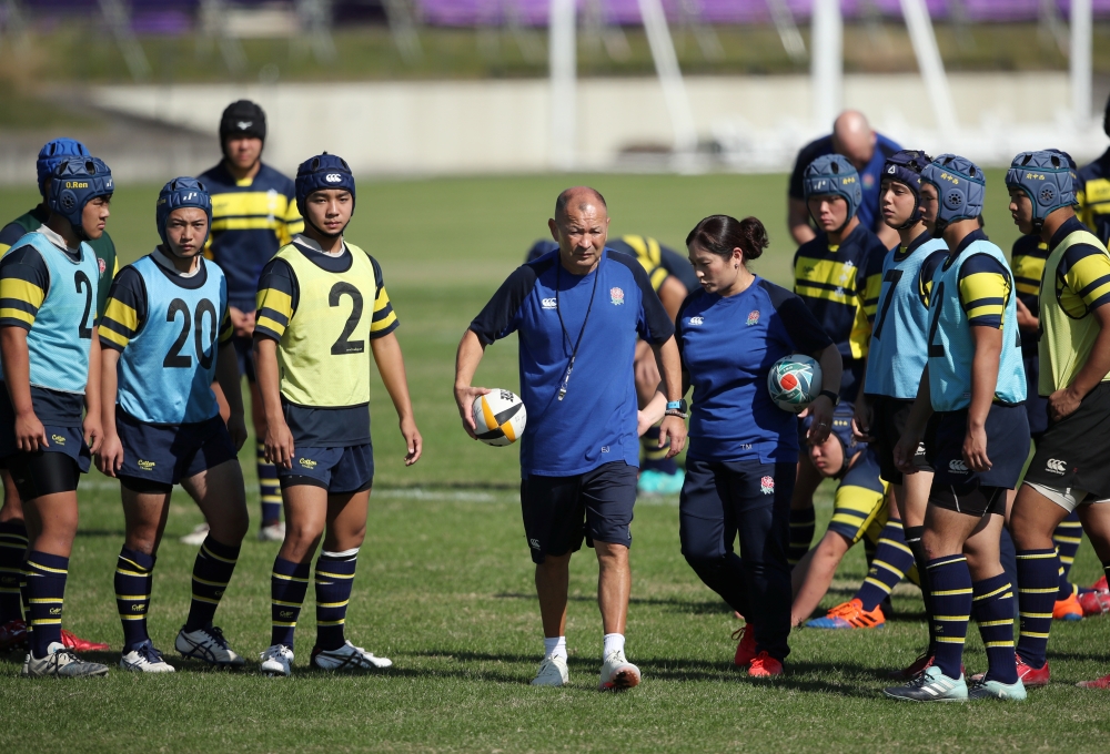 England head coach Eddie Jones runs a training session with local youth after the captain's run in preparations for the Rugby World Cup final at Fuchu Asahi Football Park, Fuchu, Tokyo, on Friday. — Reuters