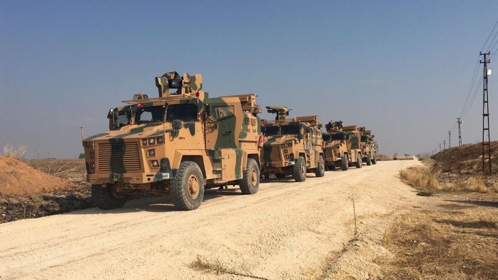 Turkish military vehicles are seen on the Turkish-Syrian border before a joint Turkish-Russian patrol in northeast Syria, near the Turkish town of Kiziltepe in Mardin province, Turkey, on Friday. — Reuters