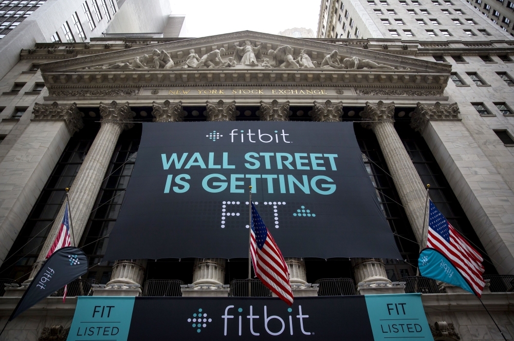 Fitbit banners decorate the exterior of the New York Stock Exchange during the IPO debut of the company in New York City in this June 18, 2015 file photo. — AFP