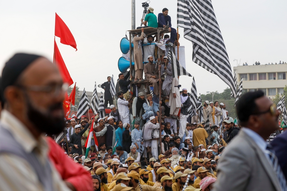 Supporters of religious and political party Jamiat Ulema-i-Islam-Fazal (JUI-F) listen to the speeches of their leaders during what participants call Azadi March (Freedom March) to protest the government of Prime Minister Imran Khan, in Islamabad, Pakistan, on Friday. -Reuters