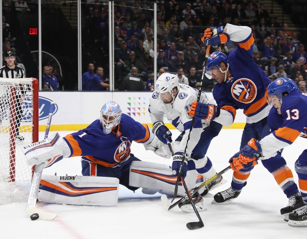 Thomas Greiss (1) of the New York Islanders makes the third period save on Alex Killorn (17) of the Tampa Bay Lightning at NYCB Live's Nassau Coliseum in Uniondale, New York, on Friday. The Islanders defeated the Lightning 5-2.  — AFP