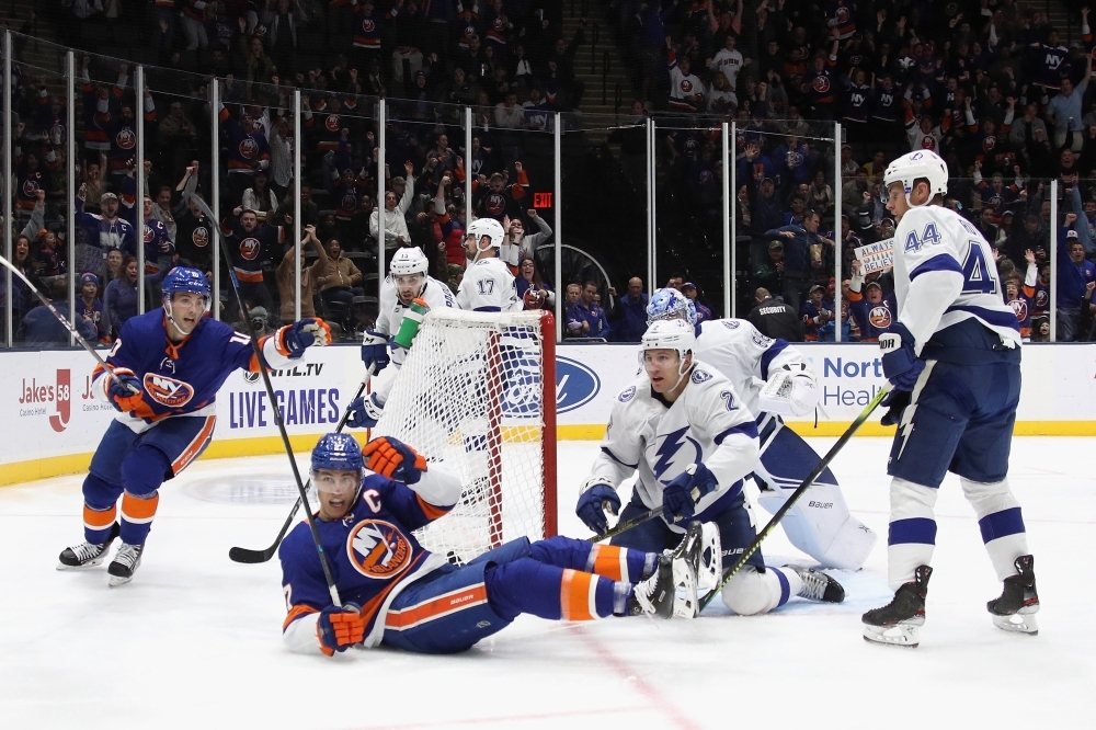 Thomas Greiss (1) of the New York Islanders makes the third period save on Alex Killorn (17) of the Tampa Bay Lightning at NYCB Live's Nassau Coliseum in Uniondale, New York, on Friday. The Islanders defeated the Lightning 5-2.  — AFP