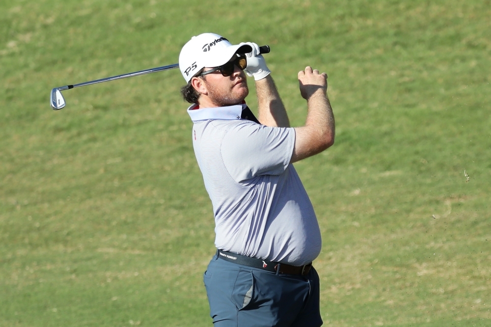 Harry Higgs of the United States plays a shot on the 14th hole during the third round of the Bermuda Championship at Port Royal Golf Course in Southampton, Bermuda, on Saturday. — AFP