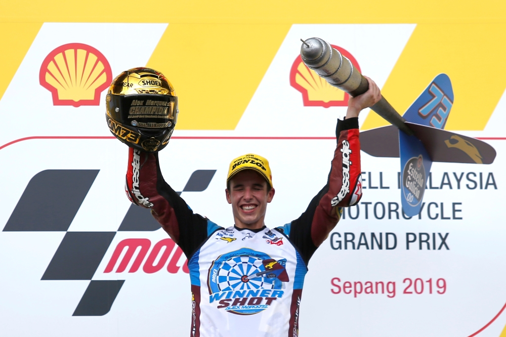 EG 0,0 Marc VDS' Alex Marquez celebrates second place and winning the Moto2 championship on the podium after the race at Sepang International Circuit, Sepang, Malaysia, on Sunday. — Reuters