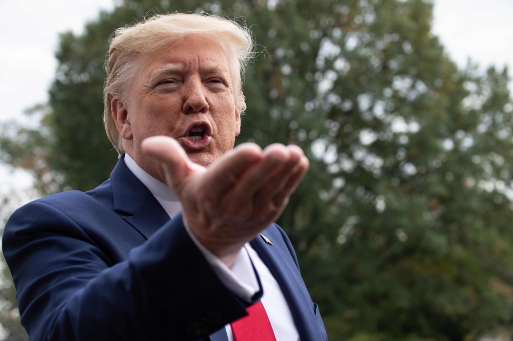 In this file photo taken on Oct. 25, 2019 US President Donald Trump speaks to the press before departing the White House in Washington, DC for South Carolina. — AFP