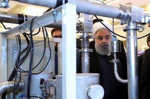  Iranian President Hassan Rohani, center, is seen during a ceremony to mark National Nuclear Technology Day in Tehran in this April 9, 2018 file photo. — AFP
