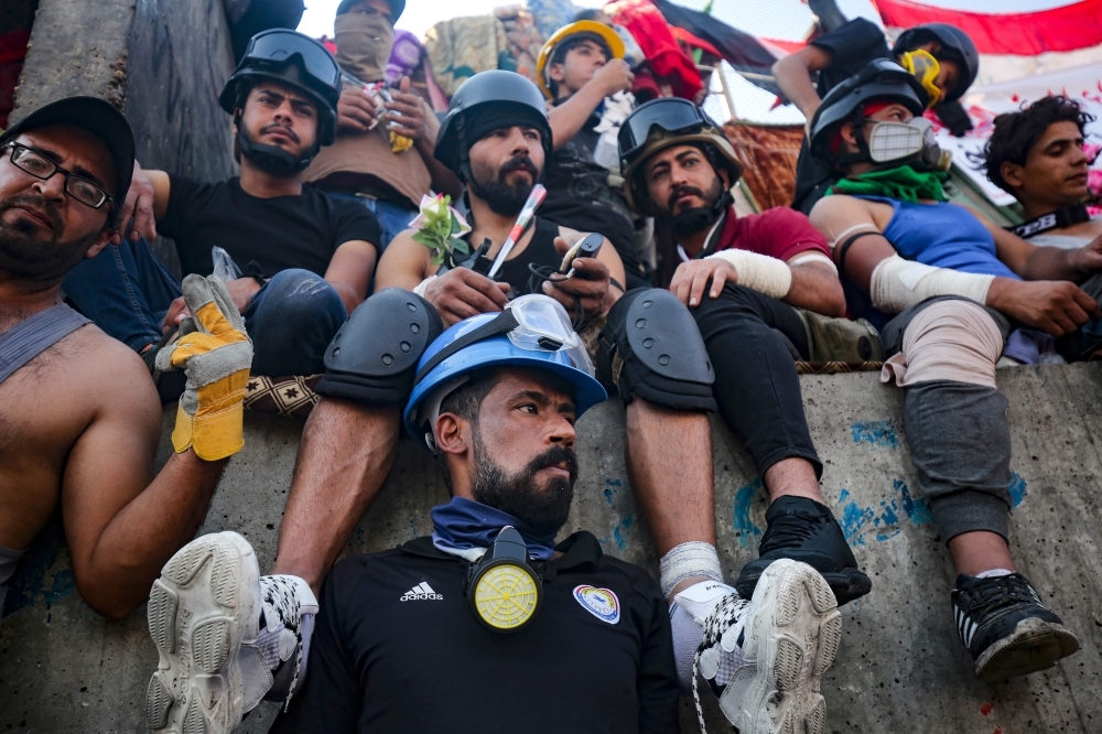 Iraqi demonstrators gather near Al-Jumhuriya bridge. which leads to the high-security Green Zone, during ongoing anti-government protests in the capital Baghdad on Monday. — AFP