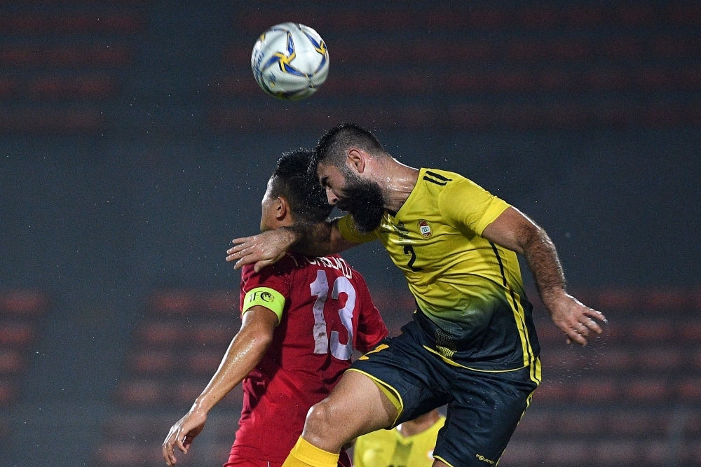 Al Ahed's players and coaching staff celebrate with the trophy after winning the 2019 AFC Cup Final between North Korea's April 25 Sports Club and Lebanon's Al Ahed FC at Kuala Lumpur Stadium in Kuala Lumpur, on Monday. — AFP