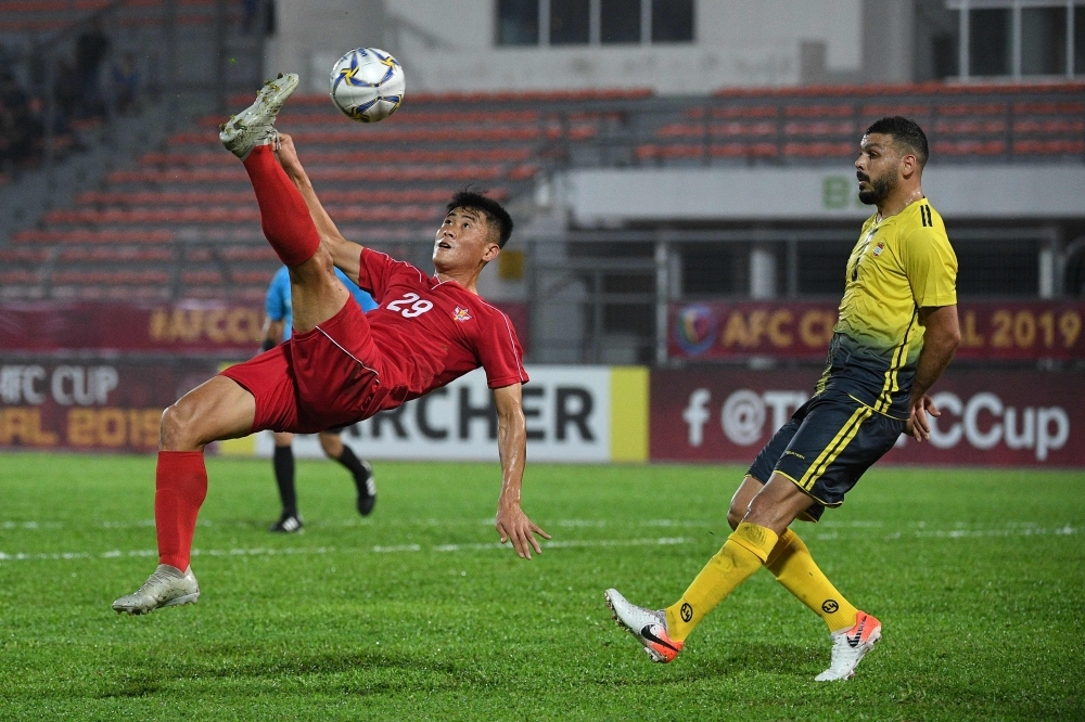 Al Ahed's players and coaching staff celebrate with the trophy after winning the 2019 AFC Cup Final between North Korea's April 25 Sports Club and Lebanon's Al Ahed FC at Kuala Lumpur Stadium in Kuala Lumpur, on Monday. — AFP