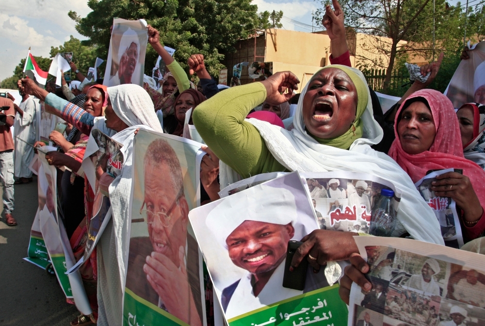 Sudanese protesters chant slogans during a demonstration by supporters and relatives of detained former regime officials to demand their release, in front of the government headquarters in the capital Khartoum, in this Oct. 30, 2019 file photo. — AFP