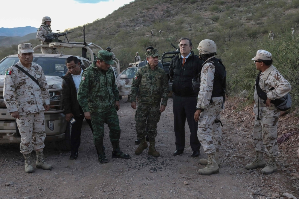 Mexican Secretary of Foreign Relations Marcelo Ebrard is pictured in the place where members of the Lebaron family were killed and burned during an gunmen ambush on Bavispe, Sonora mountains, Mexico, on Tuesday. -AFP