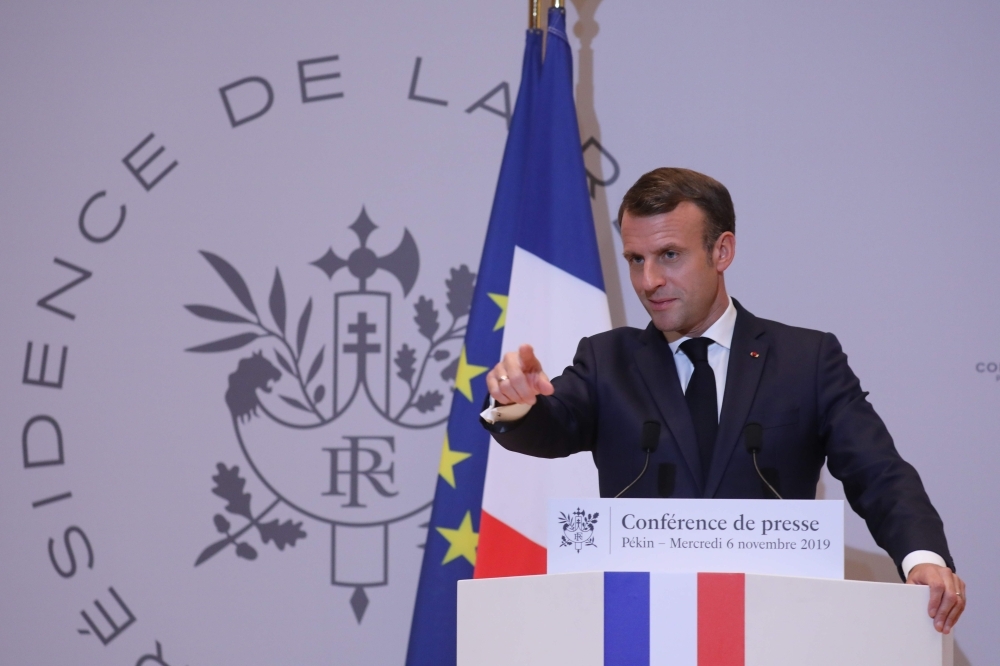 French President Emmanuel Macron holds a press conference at the French embassy at the end of his three days official visit in China, in Beijing, on Wednesday. — AFP