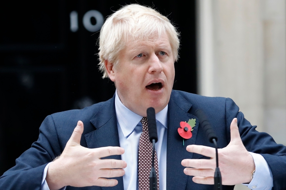 Britain's Prime Minister Boris Johnson speaks outside number 10 Downing Street in central London on Wednesday. — AFP