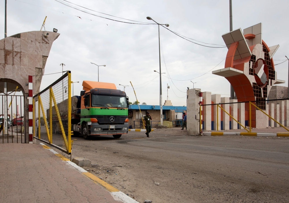 A truck drives through the gate of the southern Iraqi port of Umm Qasr after it reopened on Thursday. — AFP
