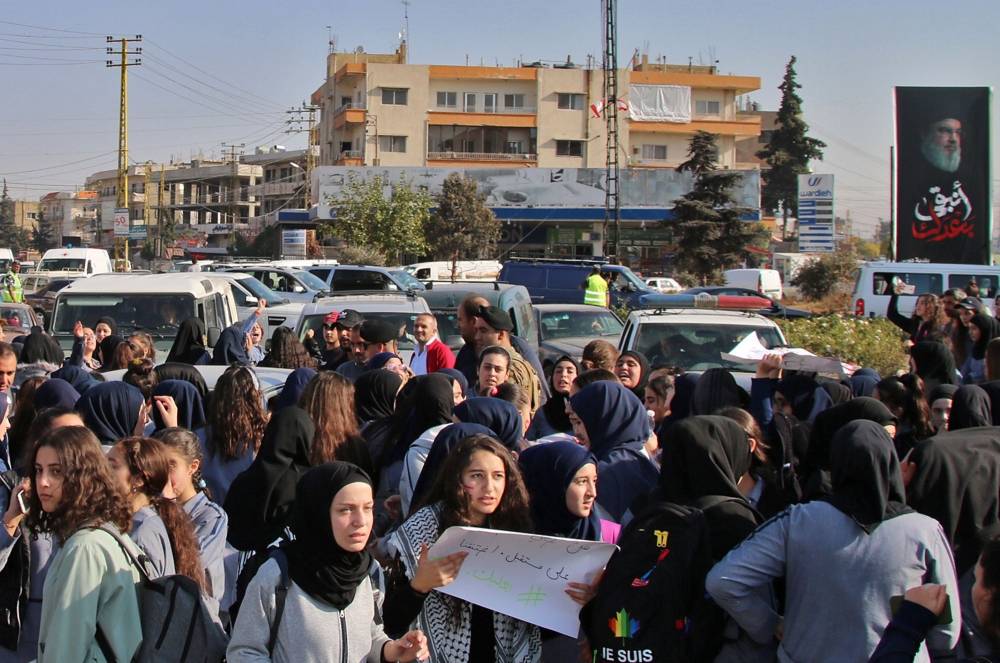 Lebanese students take part in an anti-government demonstration in the eastern Bekaa Valley city of Baalbeck on Thursday. — AFP