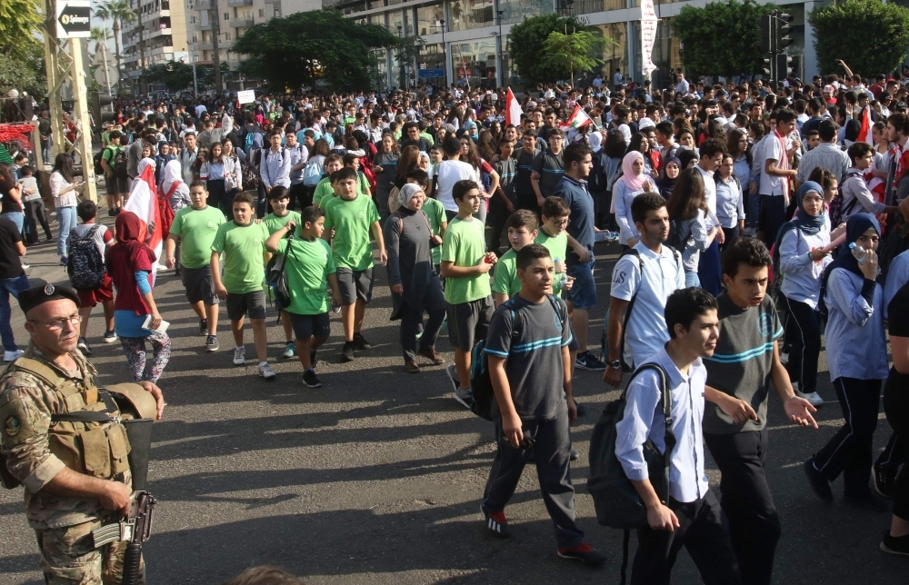Lebanese students take part in an anti-government demonstration in the southern Lebanese city of Sidon (Saida) on Thursday. — AFP