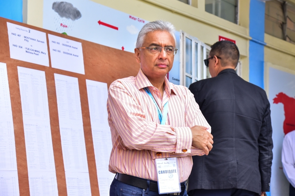 Mauritius's Prime Minister Pravind Jugnauth of Militant Socialist Movement (MSM) party observes a polling station for the Parliamentary election at Soopaya Soobiah Government School in Reduit, Mauritus, on November 7, 2019. -AFP