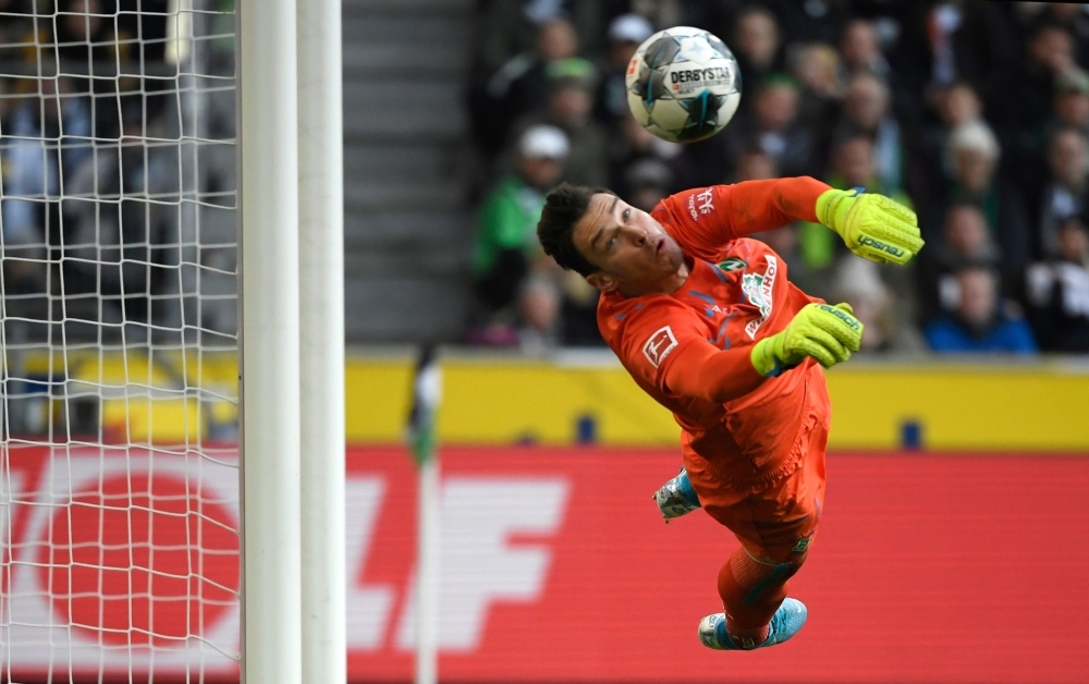 Moenchengladbach's Swiss goalkeeper Yann Sommer jumps for a ball during the German first division Bundesliga football match Borussia Moenchengladbach v Werder Bremen in Moenchengladbach, western Germany on Sunday. — AFP