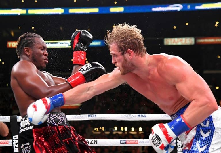 Logan Paul, right, delivers a punch to KSI in their cruiserweight fight Saturday at Los Angeles. — AFP