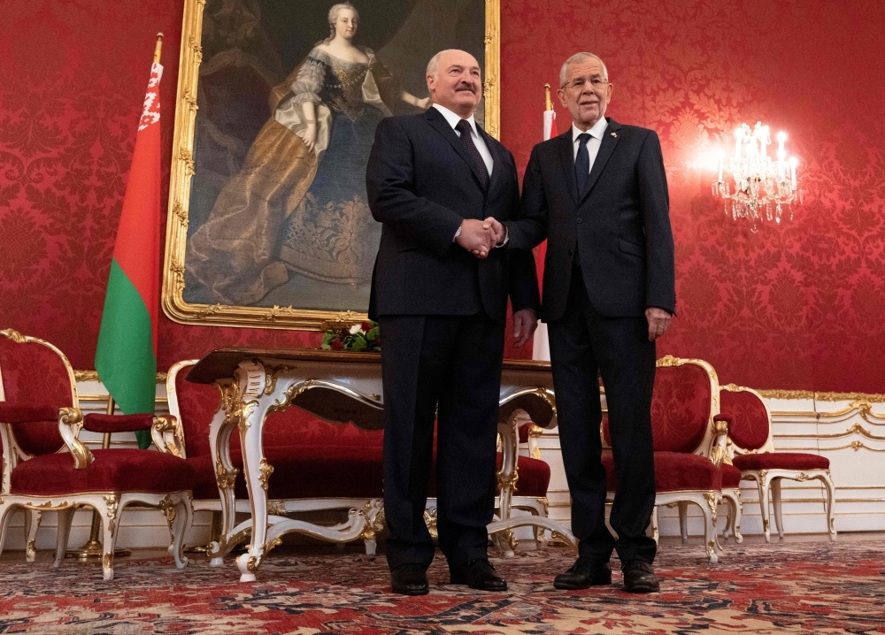 Austria's President Alexander Van der Bellen (R) shakes hands with President of Belarus Alexander Lukashenko before a meeting at Hofburg palace in Vienna, Austria on Tuesday. -AFP