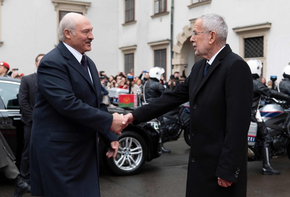 Austria's President Alexander Van der Bellen (R) shakes hands with President of Belarus Alexander Lukashenko before a meeting at Hofburg palace in Vienna, Austria on Tuesday. -AFP