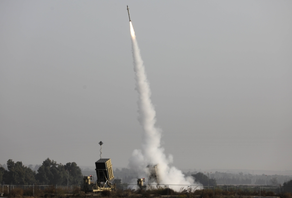 An Israeli missile launched from the Iron Dome defense missile system, designed to intercept and destroy incoming short-range rockets and artillery shells, is pictured in the southern Israeli city of Sderot on Tuesday. -AFP 