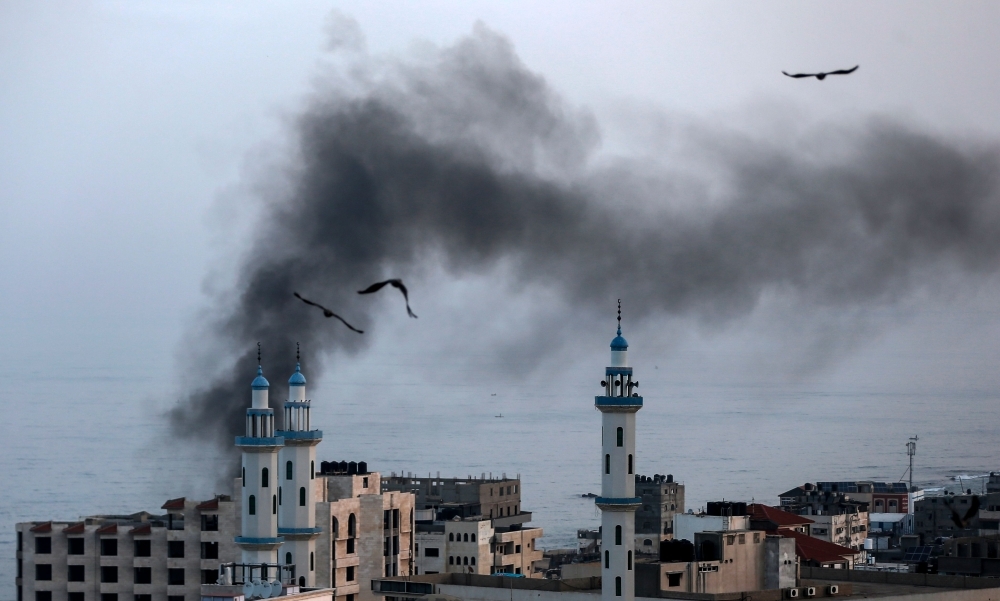 An Israeli missile launched from the Iron Dome defense missile system, designed to intercept and destroy incoming short-range rockets and artillery shells, is pictured in the southern Israeli city of Sderot on Tuesday. -AFP 