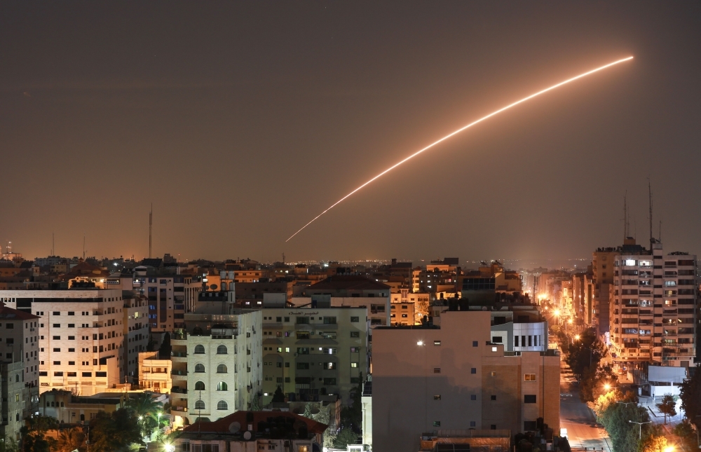 An Israeli missile launched from the Iron Dome defense missile system, designed to intercept and destroy incoming short-range rockets and artillery shells, is pictured in the southern Israeli city of Sderot on Tuesday. -AFP 