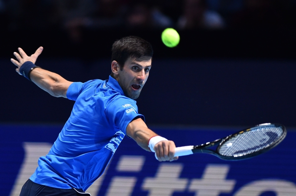 Austria's Dominic Thiem celebrates victory against Serbia's Novak Djokovic during their men's singles round-robin match on day three of the ATP World Tour Finals tennis tournament at the O2 Arena in London on Tuesday. Austria's Dominic Thiem beat Serbia's Novak Djokovic 6-7; 6-3; 7-6. — AFP