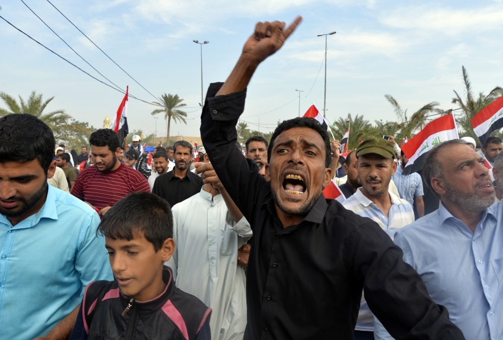Iraqis take part in a rally in the central holy city of Najaf on Friday to show solidarity with anti-government protesters in the capital Baghdad. — AFP